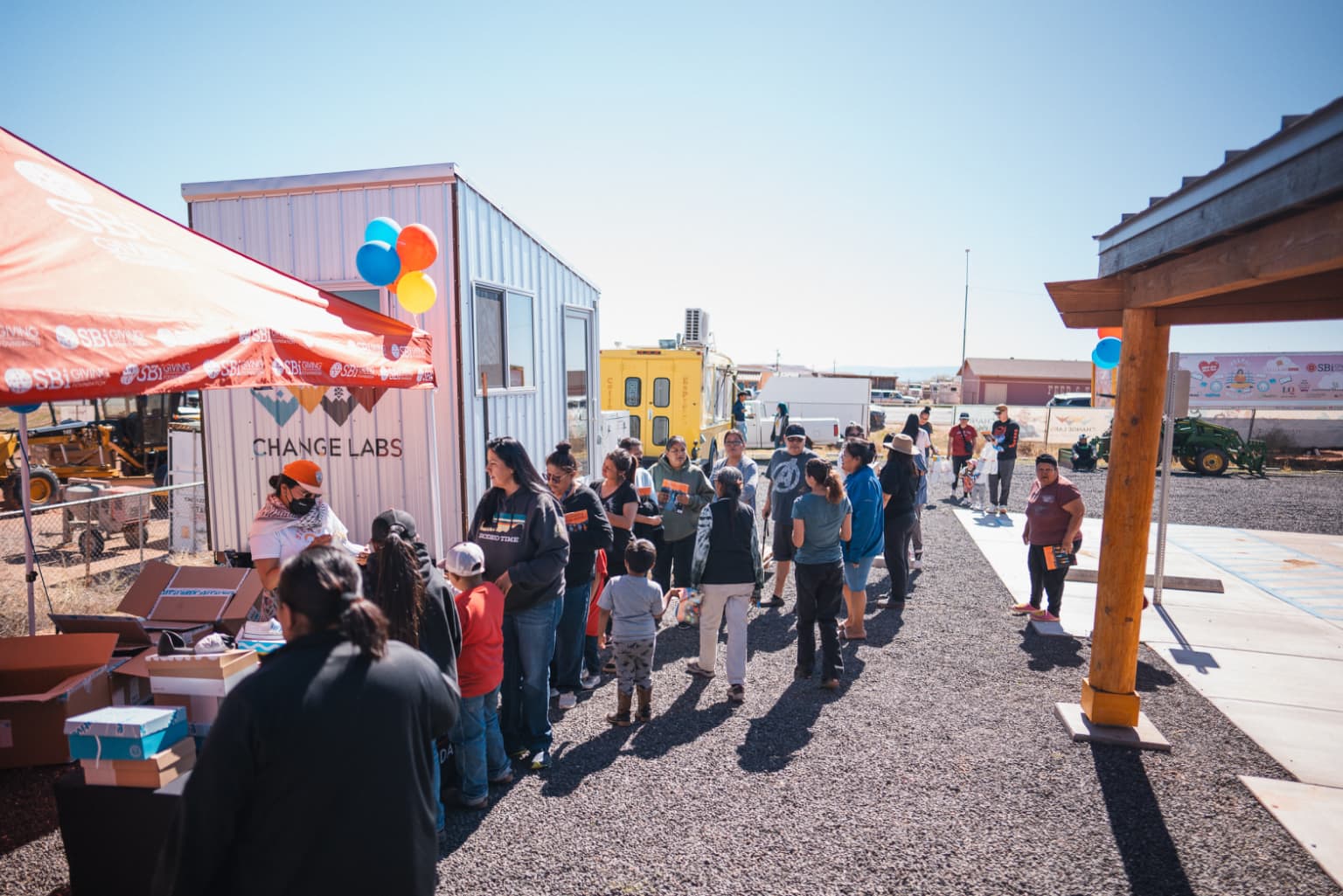 People stand in line to receive free books at an NDN Girls Book Club event in April.