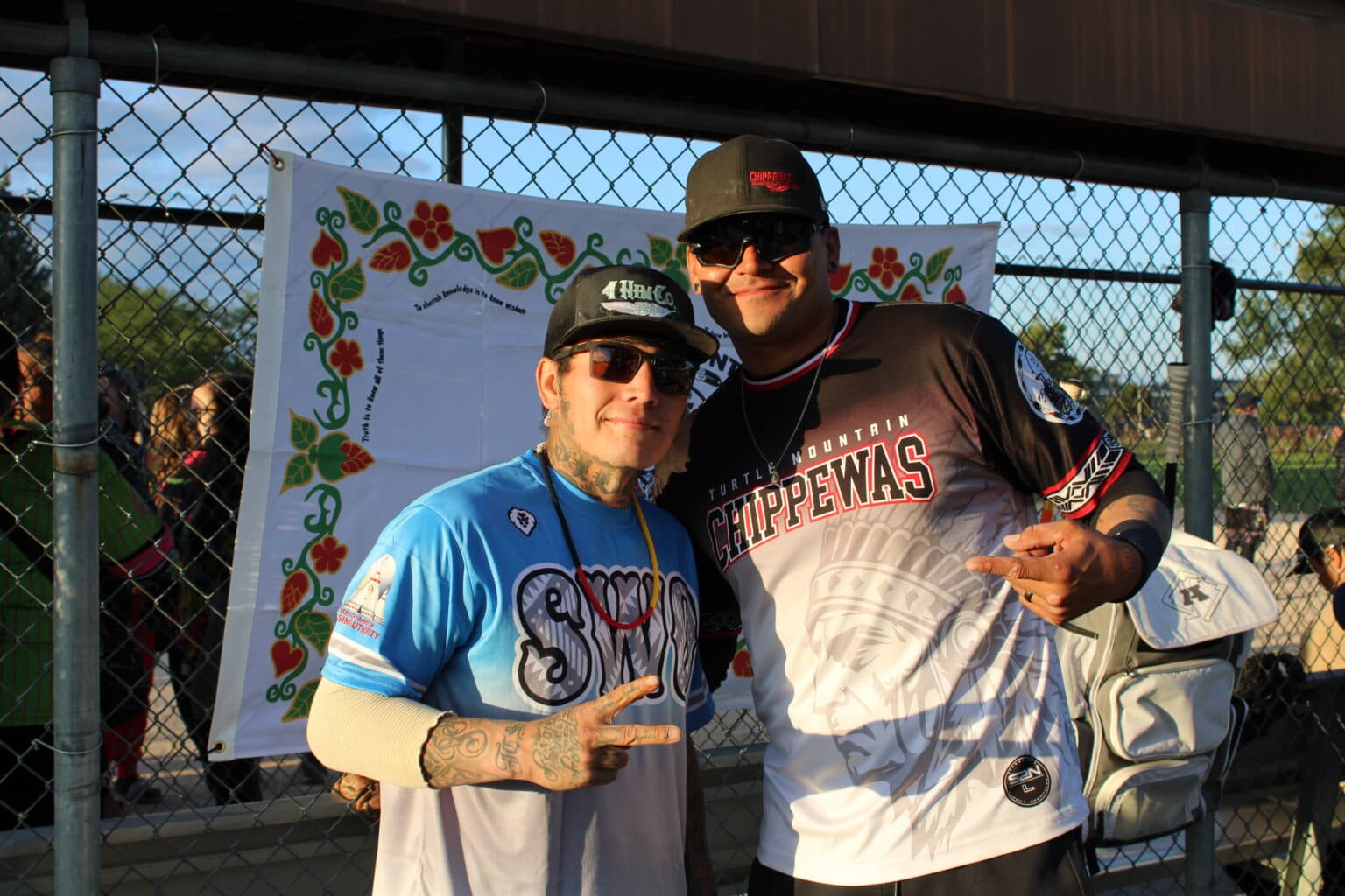 Rivals and ‘brothers’: Angelo Shepard, Sisseton Wahpeton Oyate, and Skylar Keplin, Turtle Mountain Band of Chippewa Indians, pose together in a show of solidarity between competing teams. The two played against each other twice for the Band of Nations softball tournament, Bismarck, North Dakota, Sept. 5, 2025.(Buffalo's Fire Photo/Gabrielle Nelson)