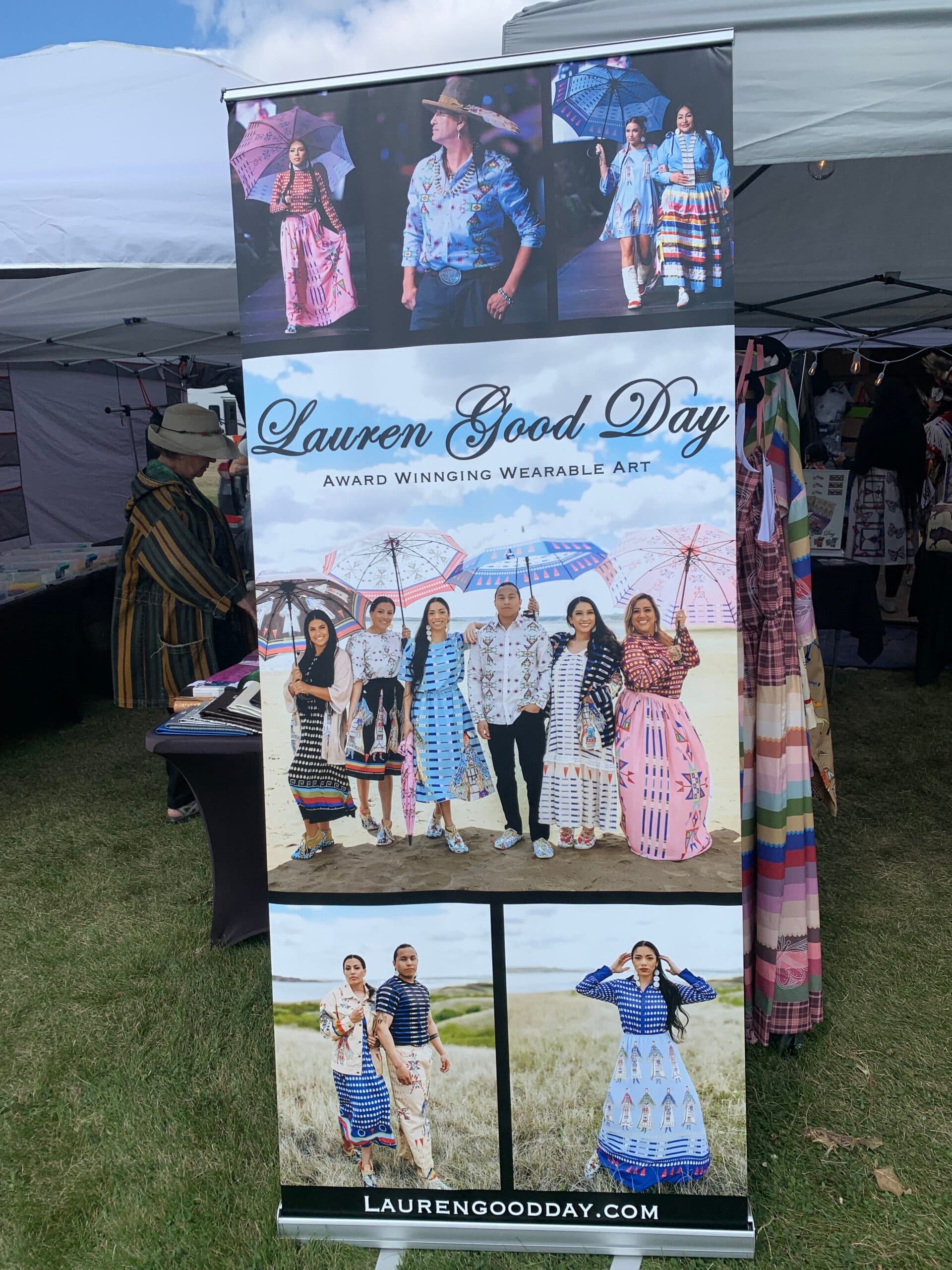 Board outside Lauren Good Day’s booth showcases models wearing her clothing brand (Sept 6.) (Buffalo’s Fire Photo/Jolan Kruse)
