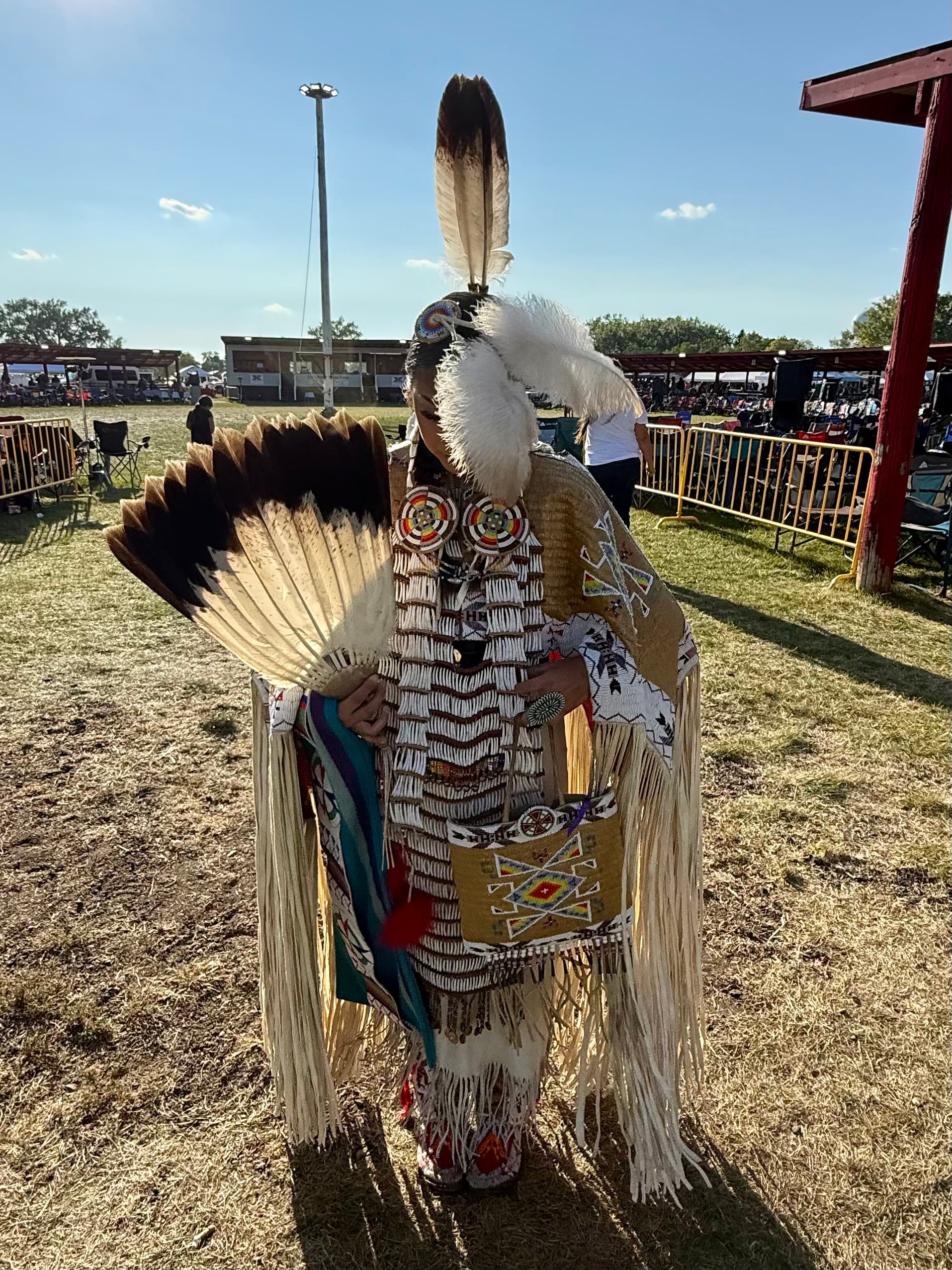 Tosha McCloud, first place teen girls traditional dancer at the 55th UTTC International Powwow, wears a Russwear dentalium breastplate made for her by her dad, Russell McCloud, Bismarck, North Dakota, Saturday, Sept. 6, 2025.