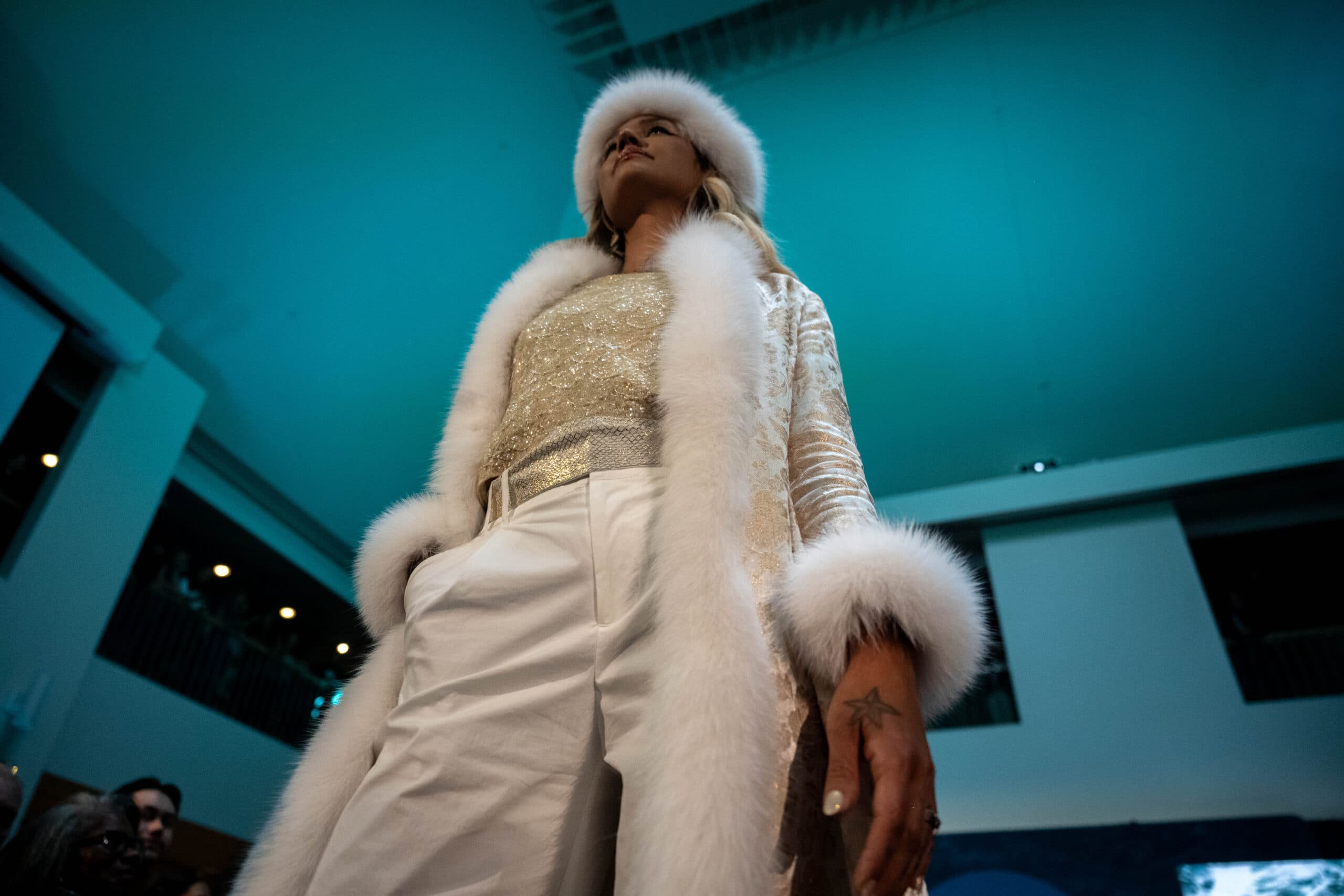 Model Kenzi Sehguk Osgood wears a design by Iñupiaq artist and fashion designer Jackie Qataliña Schaeffer at the Far North Fashion Show in Anchorage, Alaska, Wednesday, July 30, 2025.