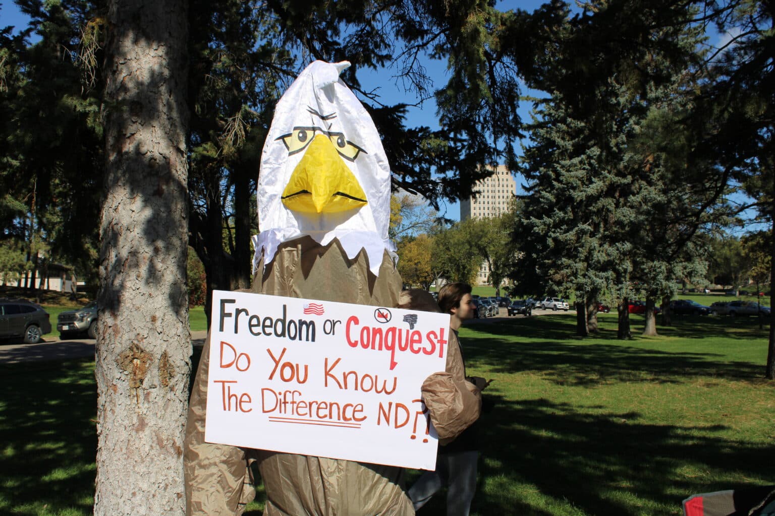 Standing Rock Sioux Tribe citizen Cheryl Kary, executive director of the Sacred Pipe Resource Center, protested in an eagle costume at the “No Kings” rally, Bismarck, North Dakota, Saturday, Oct. 18, 2025. (Buffalo’s Fire/Gabrielle Nelson)