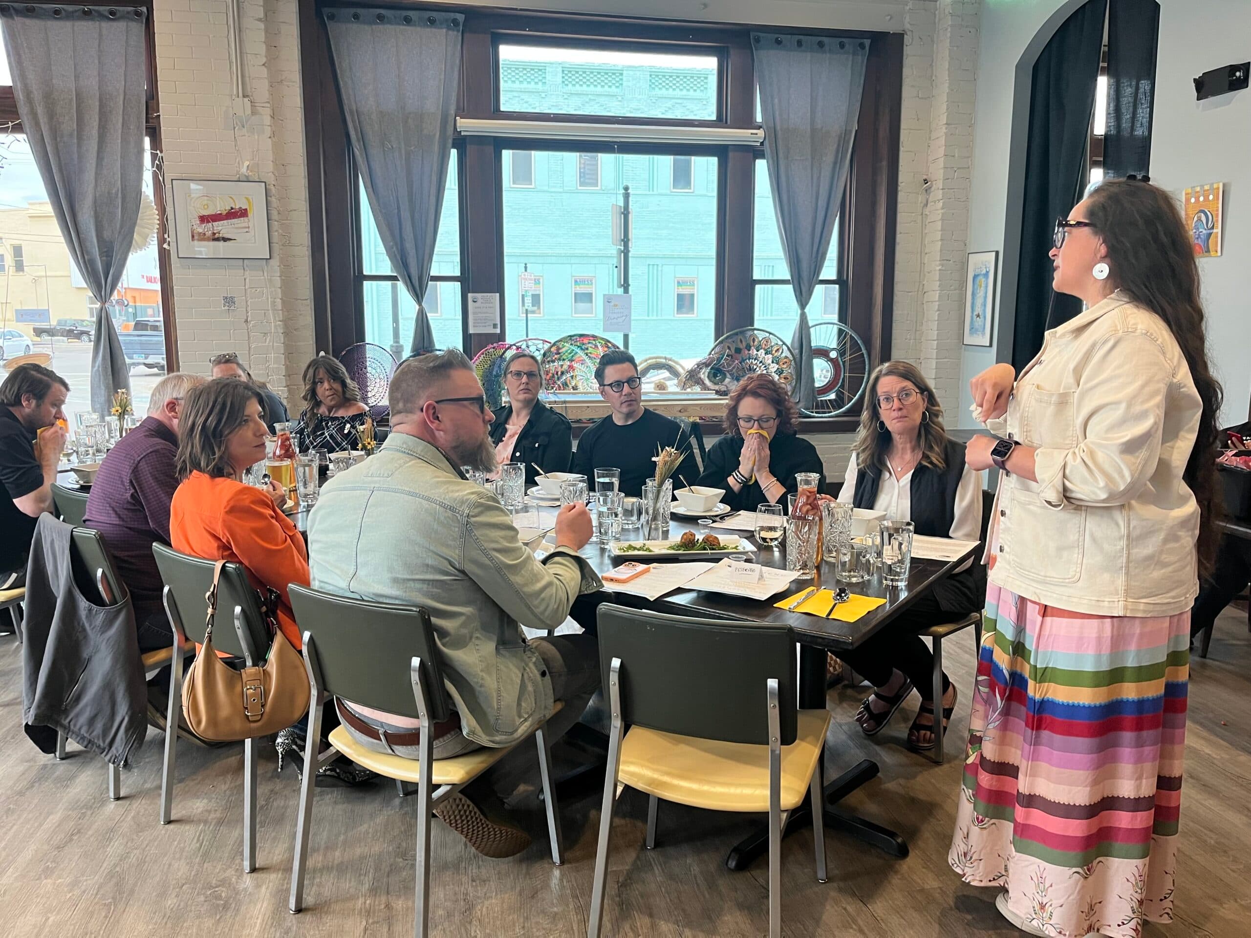 Ruth De La Cruz speaks between dinner courses about Native food traditions at Aurora Nights, Minot, North Dakota, Monday, April 28, 2025. (Prairie Sky Breads/Jazmine Schultz)