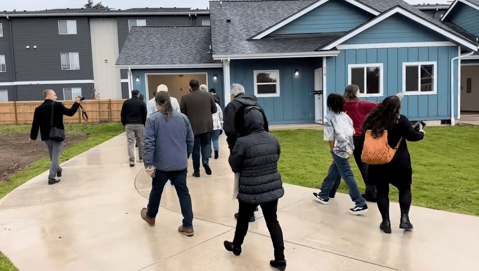 Visitors tour the Kloshe Illahee Haws Housing development along with Salem and tribal officials, Sept. 29, 2025.