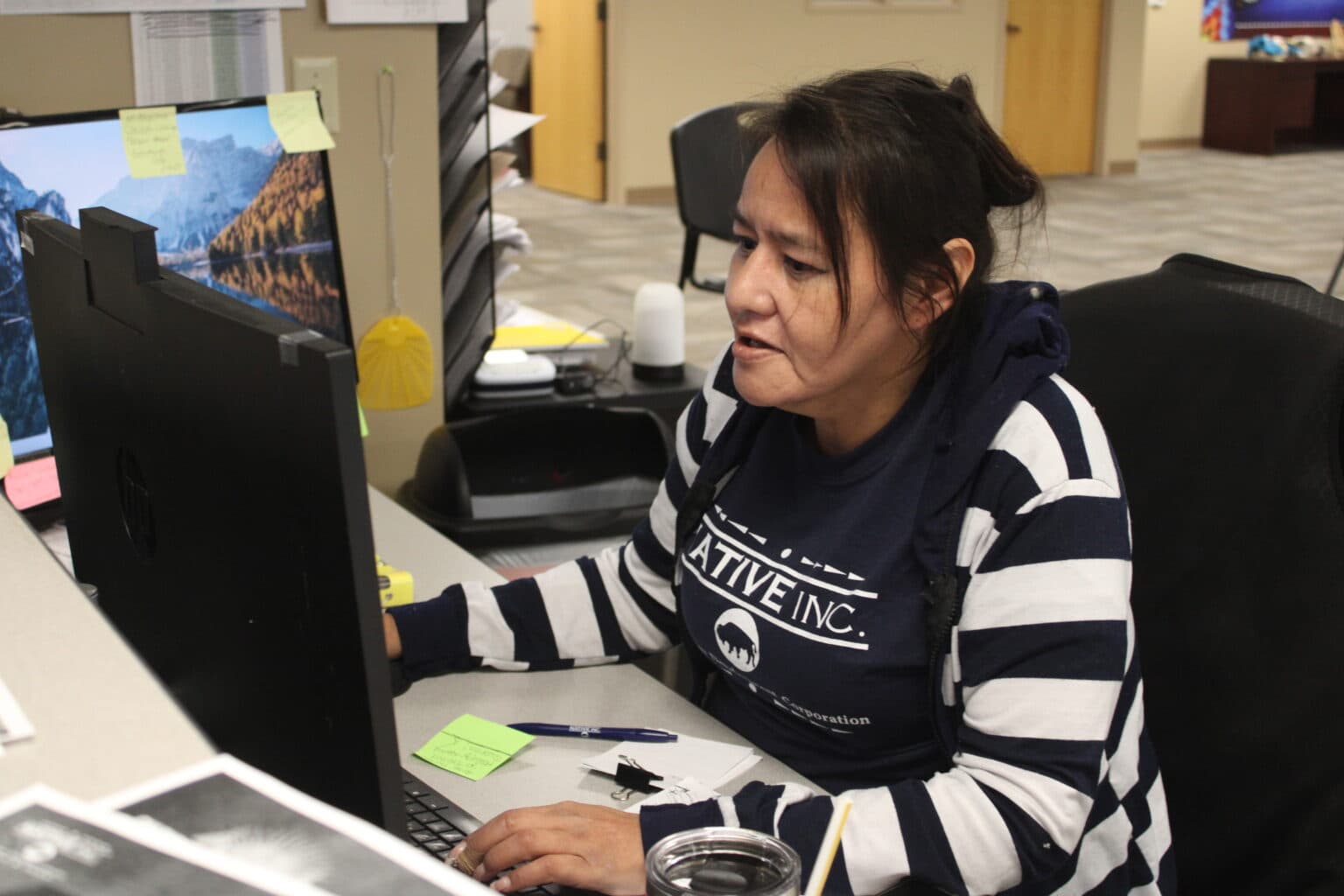 Angela Buckley-Tochek works at the Native Inc. reception desk, Bismarck, North Dakota, Wednesday, Nov. 12, 2025. (Buffalo’s Fire/Gabrielle Nelson)