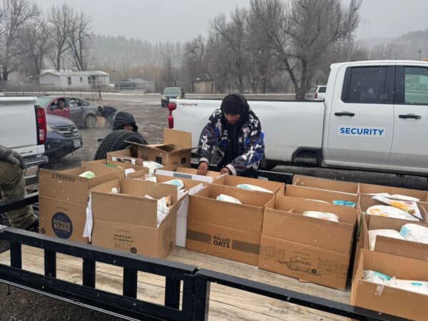 Volunteers load up a trailer with boxes of food that were distributed to each district on the Northern Cheyenne Reservation, Montana, Wednesday, Nov. 26, 2025. (Generations for Hope/Tonah Fishinghawk-Chavez)