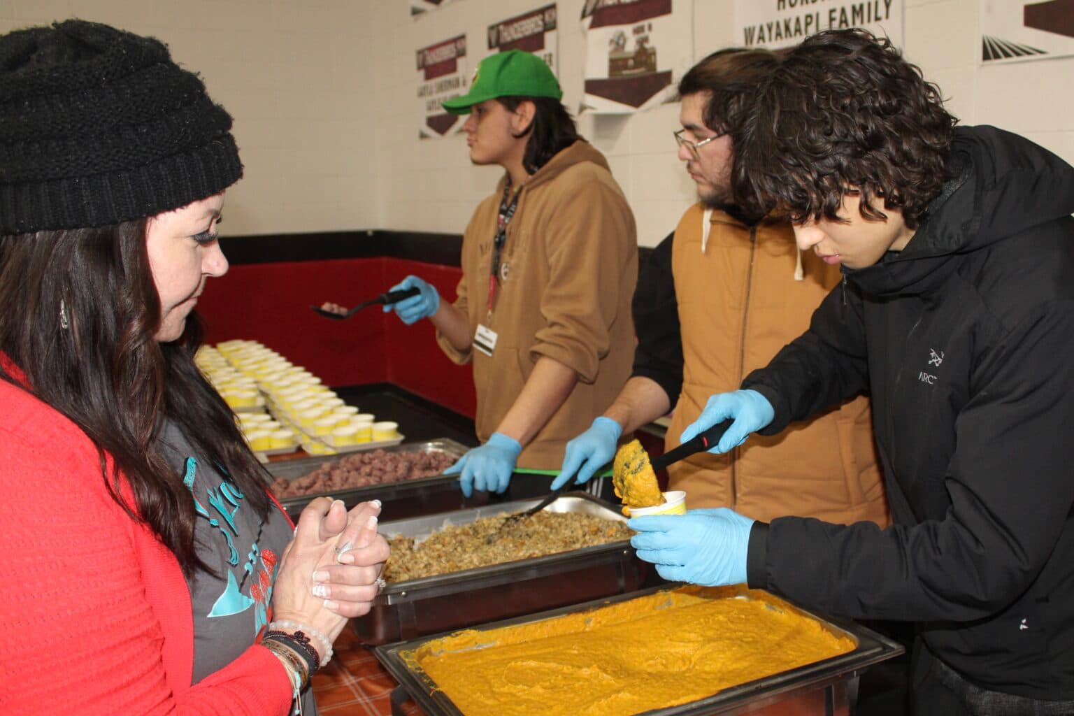 UTTC students from the Mandan, Hidatsa and Arikara Nation serve cornballs, squash soup and the four sisters dish made with beans, corn, sunflower seeds and squash at the UTTC “Taste the Earth” event, Bismarck, North Dakota, Tuesday, Nov. 25, 2025.