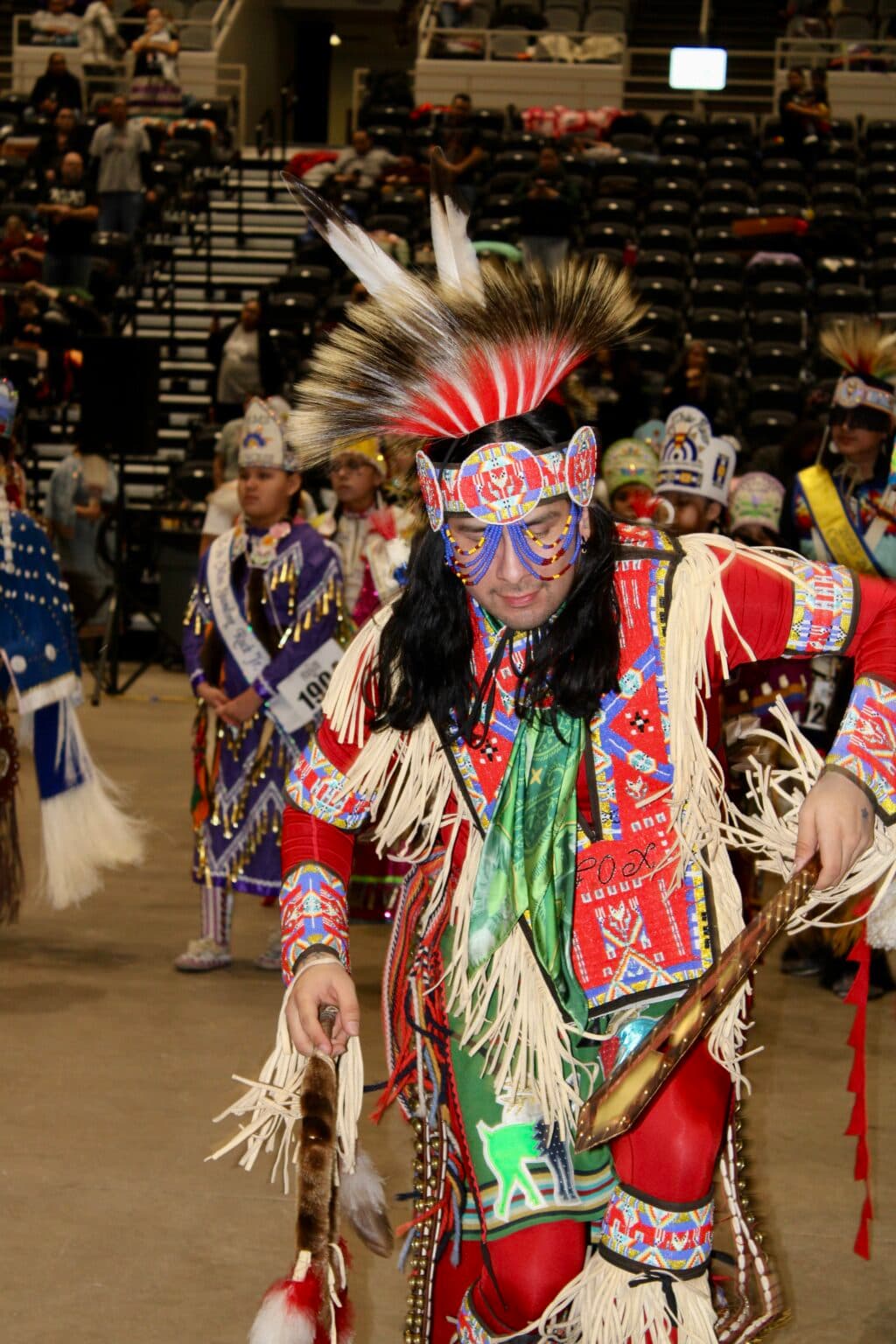 A powwow attendee dances in the first grand entry, Bismarck Event Center, North Dakota