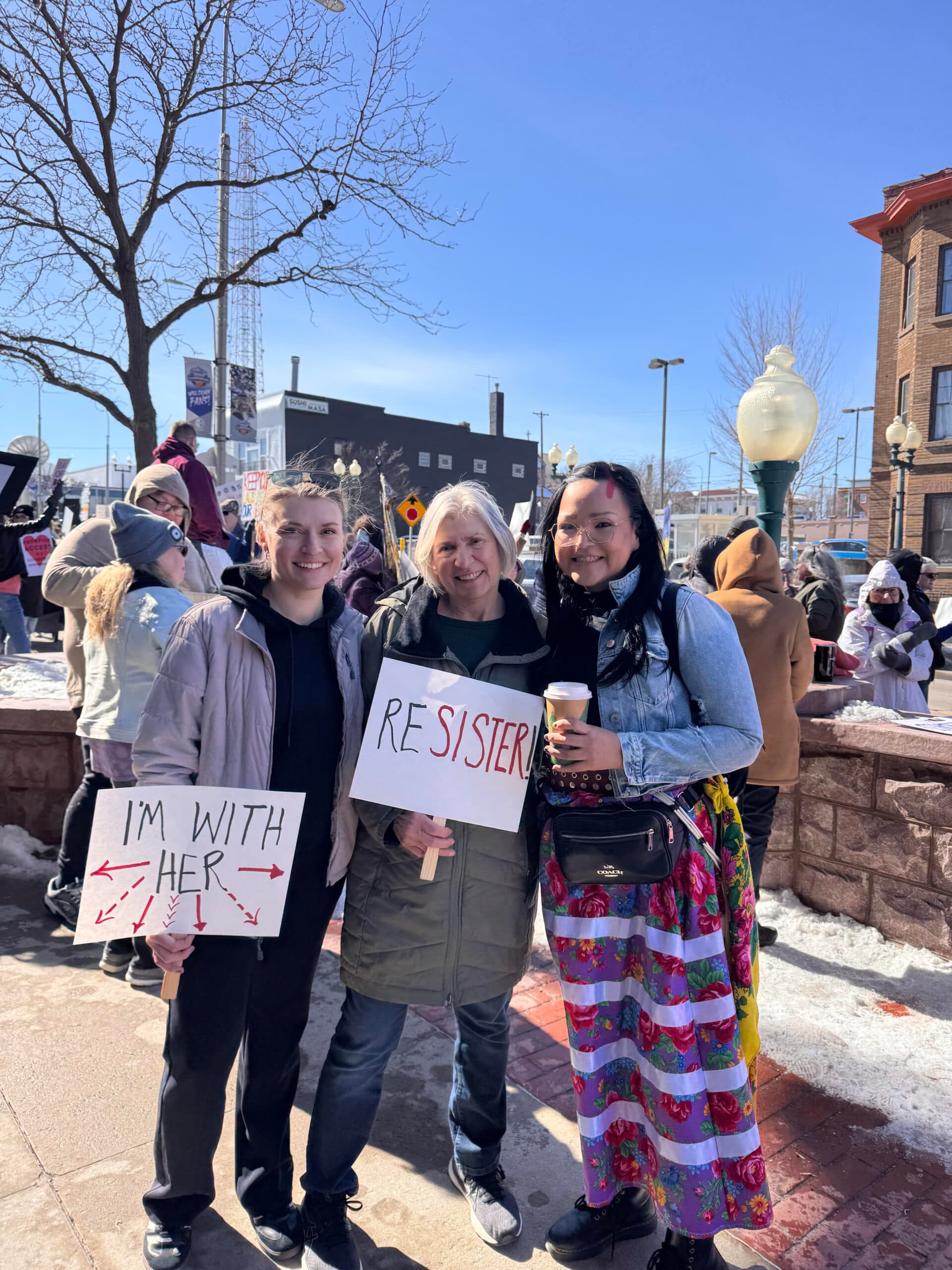 Allison Renville protests with friends at the International Women’s Day rally in Sioux Falls, South Dakota.