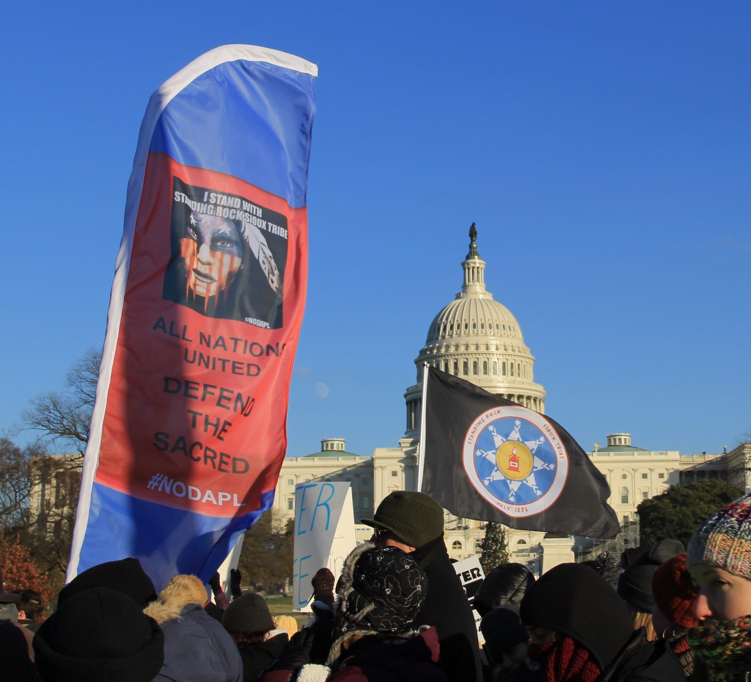 Beyond NoDAPL March on Washington, DC. Native American flag and banner at US Capitol. Dec. 8, 2016.