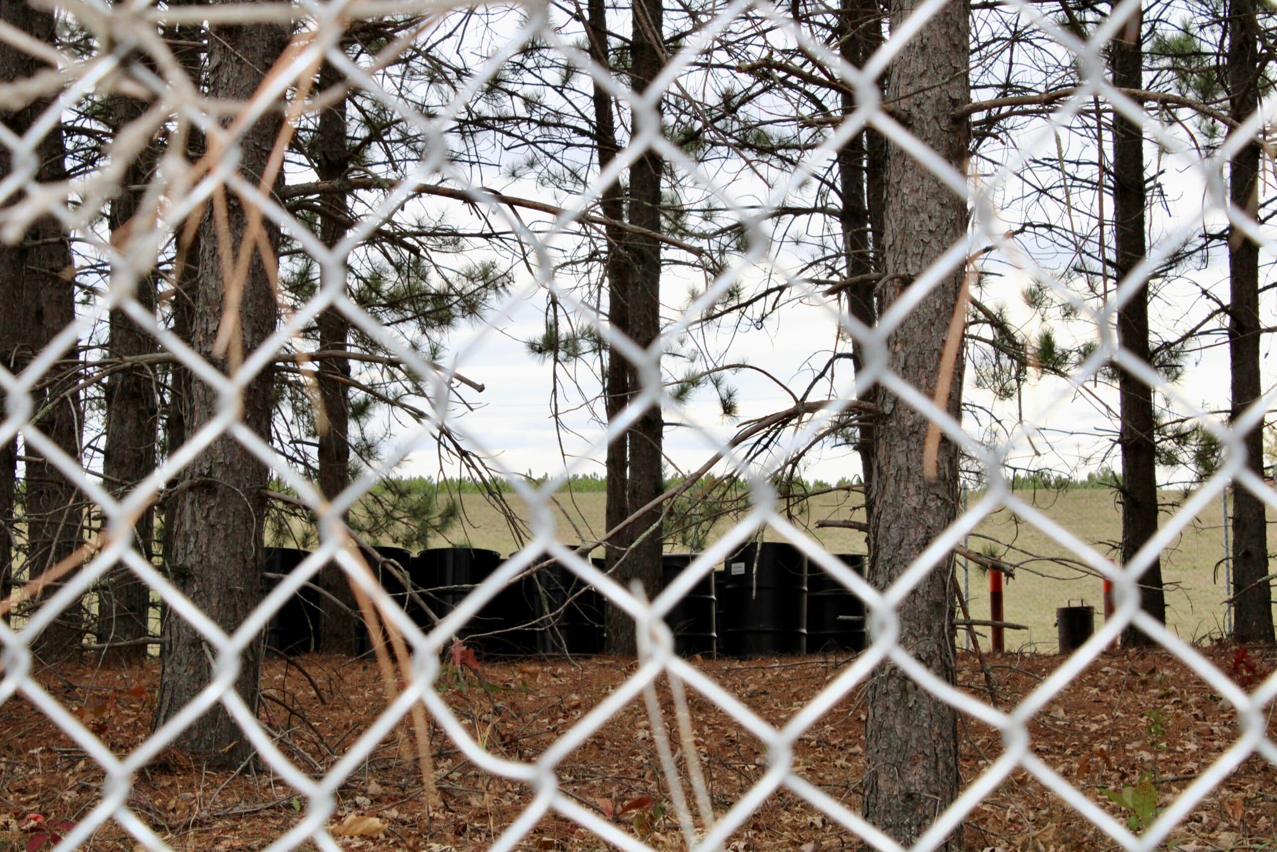 Bins containing hazardous waste sit at the edge of “the vault,” which holds 42,000 cubic yards of contaminated soil and sludge from the St. Regis Paper Co. Superfund Site, Cass Lake, Minnesota.