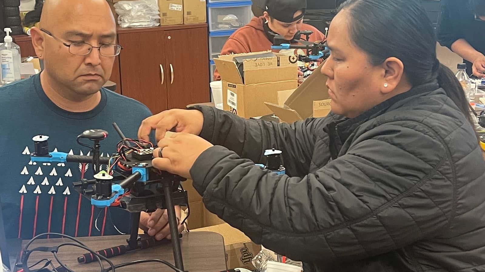 ASPIRE Summer Academy offers an eight-week paid internship where students collaborate with experts from national labs, produce a project and refine their engineering skills. Pictured are interns working on a drone for their project during the 2024 program. (Photo courtesy of Alexa Azure)