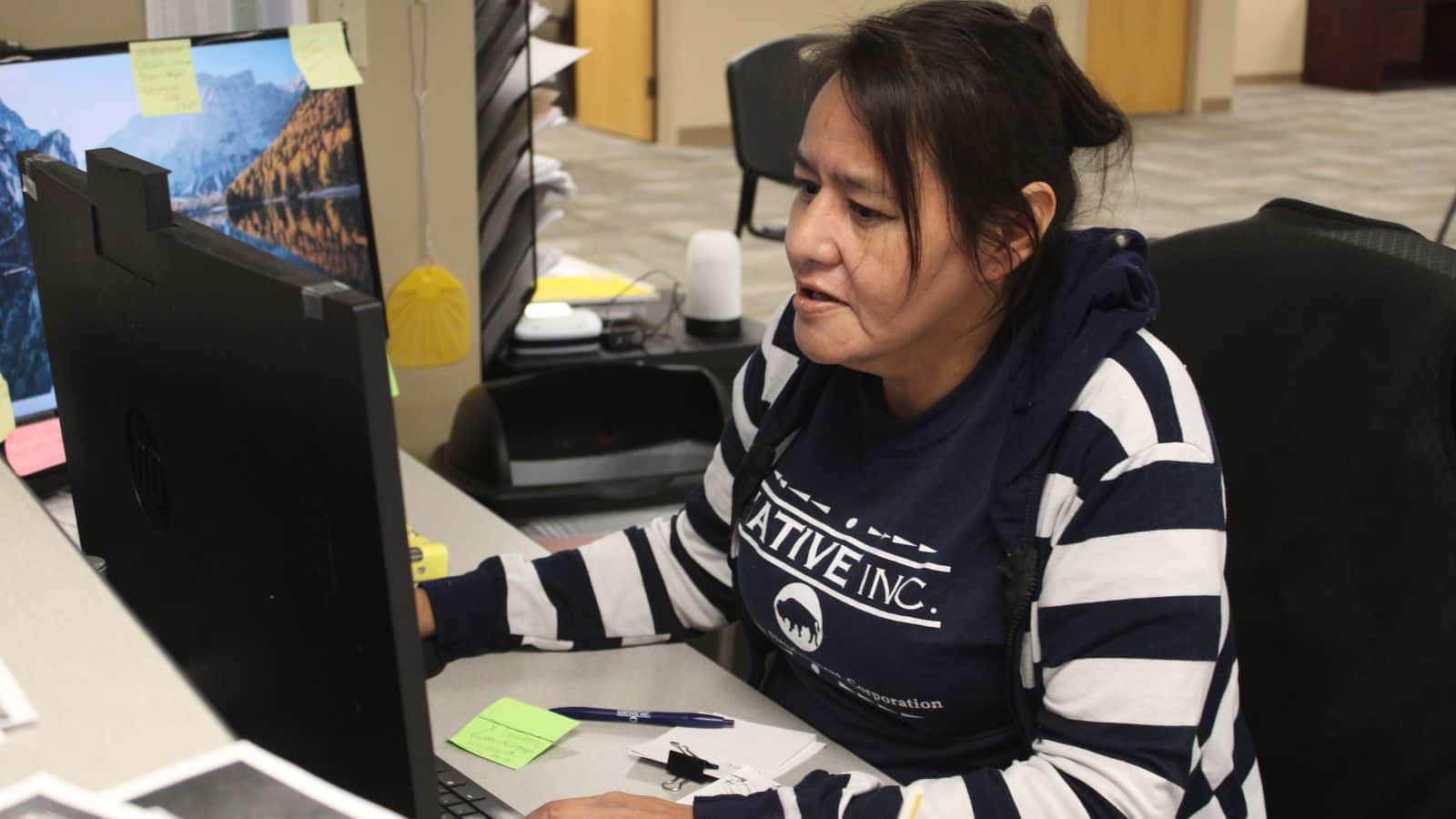Angela Buckley-Tochek works at the Native Inc. reception desk, Bismarck, North Dakota, Wednesday, Nov. 12, 2025. (Buffalo’s Fire/Gabrielle Nelson)