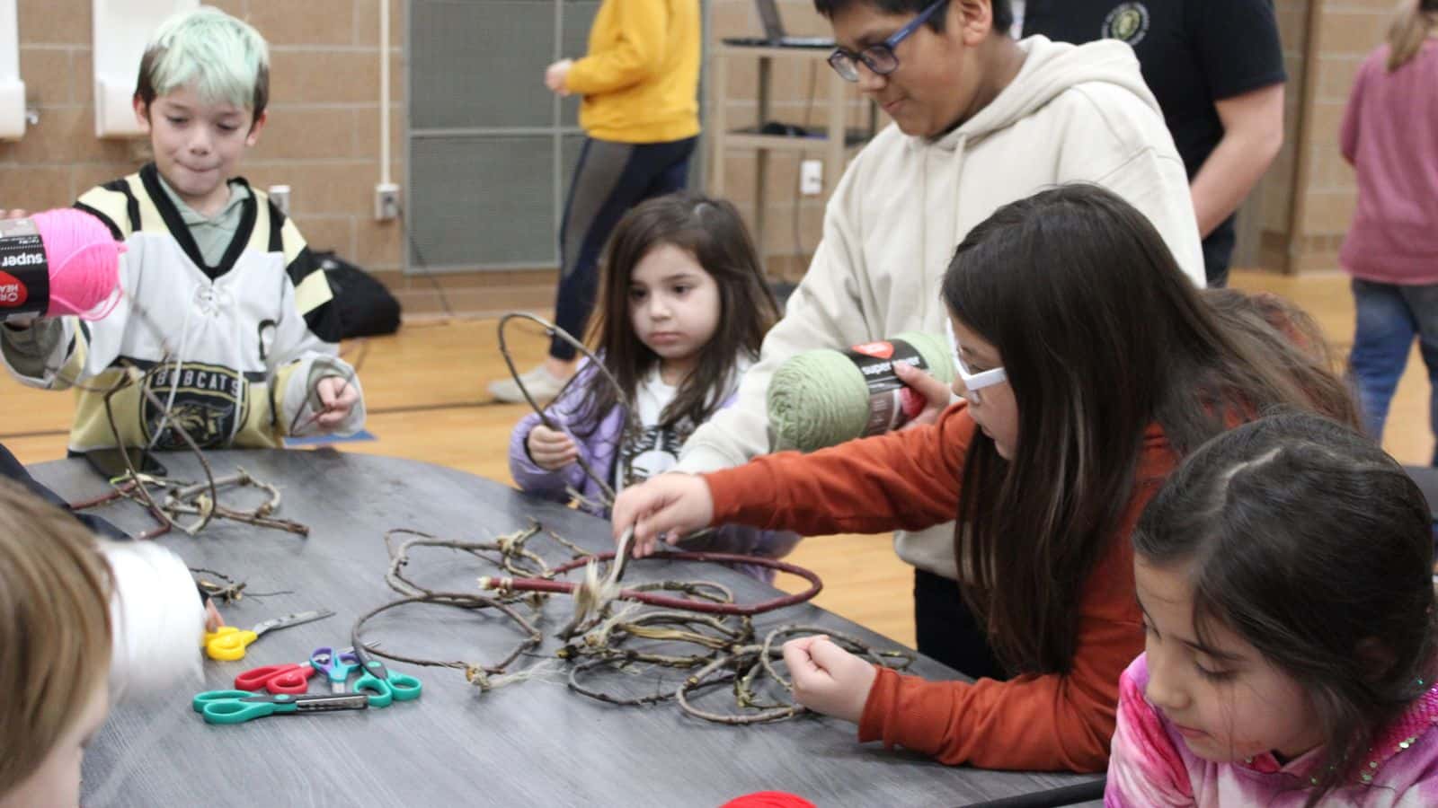 Students from Solheim Elementary School chose which beads to use for their dreamcatcher on Dec. 18. Photo credit/ Adrianna Adame