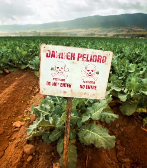 Poison pest control chemicals sprayed on a field in the Salinas Valley, California USA
