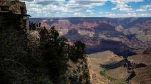 Tourists look out from the South Rim at the Grand Canyon on Thursday, May 4, 2023. The Havasupai Tribe held a blessing ceremony to mark the renaming of a popular campground from Indian Garden to Havasupai Gardens. (AP Photo/Ty O'Neil)