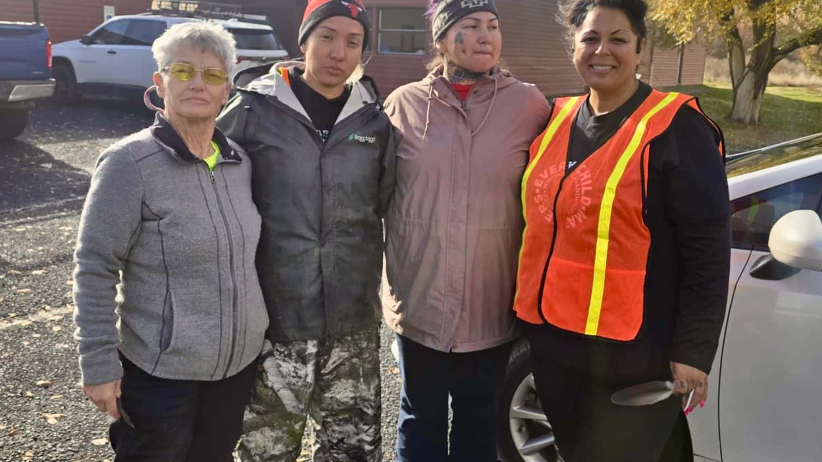 Crook County Search and Rescue K9 Unit’s Karen Marcotte, Jones’s daughters Twila Jones and Mollyanne Jones, and MMIW Search & Hope Alliance’s Kimberly Lining pause during their search on Monday, November 3, 2025. (Photo credit: Jason Shifflett)