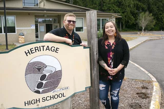 Heritage High Principal Dr. Nathan Plummer and Tulalip Education Division Executive Director Jessica Bulstad stand out front at Heritage High School on Thursday, Aug. 4, 2022, in Marysville, Washington. (Ryan Berry / The Herald)