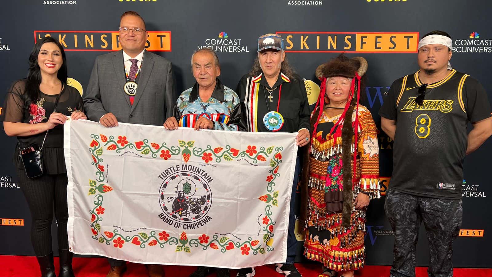 “Waabishki (White) Mashkode-bizhiki (Bison)” director, Justin Deegan, and producer, Les Thomas, pose for a photo at the LA Skins Fest with Turtle Mountain Band of Chippewa citizens who played a part in the short documentary. From left to right: Kathy Renault, Justin Deegan, Lynn Gourneau, Les Thomas, JT Shining Oneside and Trevor Gunville, TCL Chinese Theatre, Los Angeles, California, Friday, Nov. 21, 2025. (Photo courtesy of Justin Deegan)
