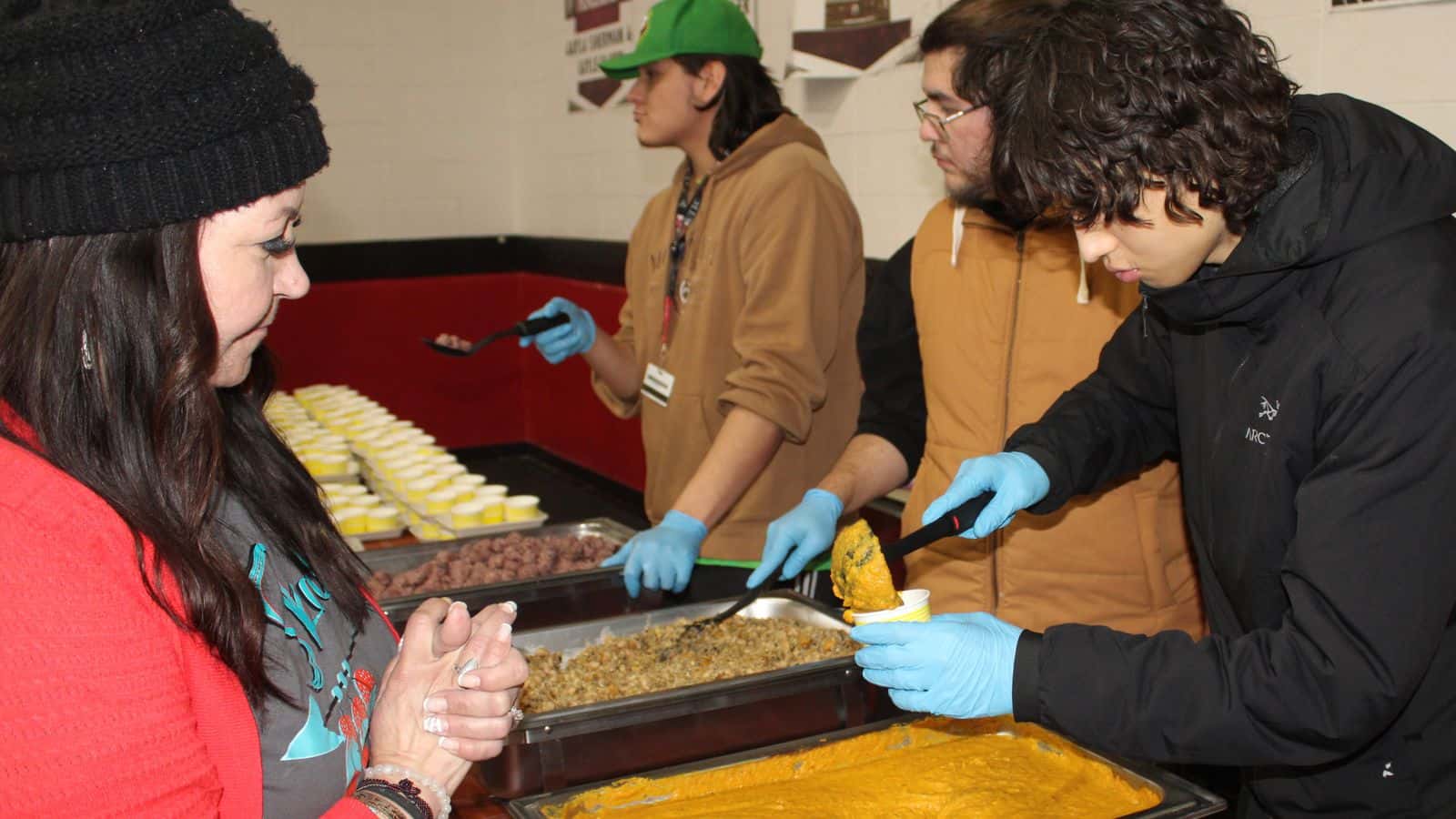 UTTC students from the Mandan, Hidatsa and Arikara Nation serve cornballs, squash soup and the four sisters dish made with beans, corn, sunflower seeds and squash at the UTTC “Taste the Earth” event, Bismarck, North Dakota, Tuesday, Nov. 25, 2025.