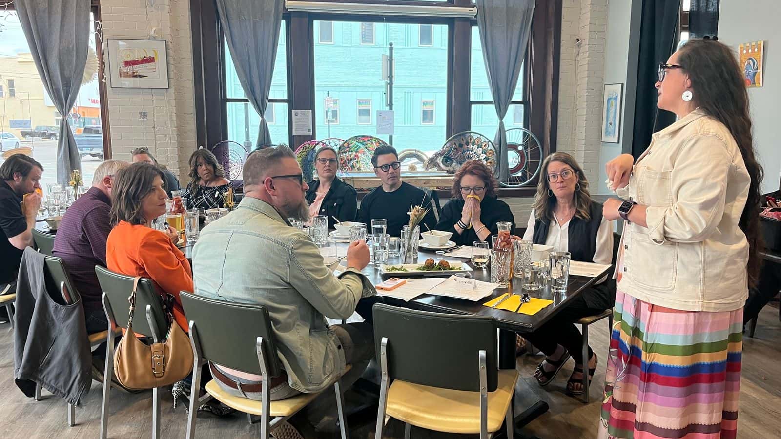 Ruth De La Cruz speaks between dinner courses about Native food traditions at Aurora Nights, Minot, North Dakota, Monday, April 28, 2025. (Prairie Sky Breads/Jazmine Schultz)