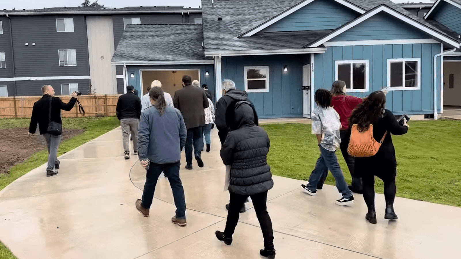Visitors tour the Kloshe Illahee Haws Housing development along with Salem and tribal officials, Sept. 29, 2025.