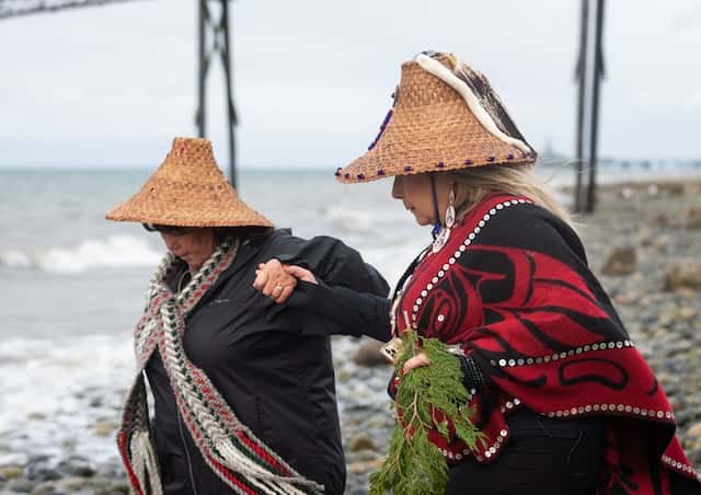 Lummi Tribal members Ellie Kinley, left, and Raynell Morris, president and vice president of the non-profit Sacred Lands Conservancy known as Sacred Sea, lead a prayer for the repatriation of southern resident orca Sk’aliCh’elh-tenaut — who has lived and performed at the Miami Seaquarium for over 50 years — to her home waters of the Salish Sea at a gathering Sunday, March 20, 2022, at the sacred site of Cherry Point in Whatcom County, Wash.
The Bellingham Herald