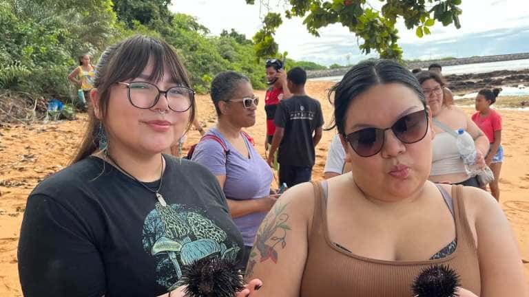 While on the cultural exchange to Brazil, the Red Lake Nation College students spent time with the Indigenous tribe called the Tupinikim. While there they tried customary foods, including sea urchin, which Michelle Anderson (left) and Nicole Good (right) are seen holding. (Courtesy photo)