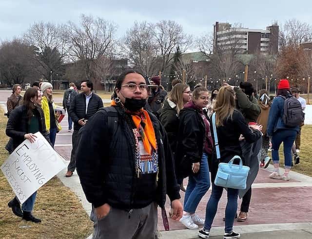 UM Kyiyo Powwow President Zach Rides At The Door stands in the crowd at the protest.
Photo: JoVonne Wagner