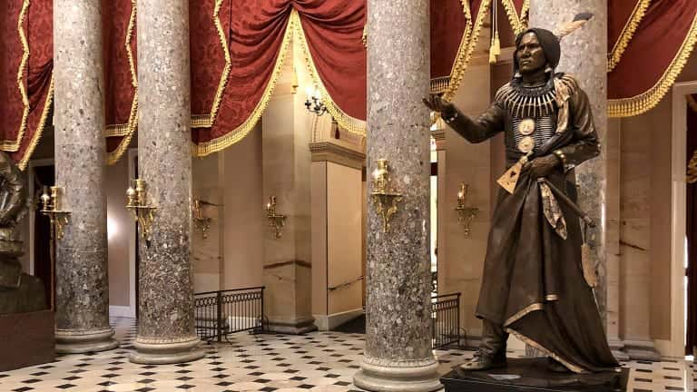 This undated photo shows a bronze statue of Ponca Tribal Chief Standing Bear at the U.S. Capitol in Washington. A tomahawk once owned by Chief Standing Bear, a pioneering Native American civil rights leader, will be returning to his Nebraska tribe after decades in a museum at Harvard. The university's Peabody Museum of Archaeology & Ethnology says it's been working with members of the Ponca Tribe in Nebraska and Oklahoma to repatriate the artifact. (Joseph Morton/Omaha World-Herald via AP)