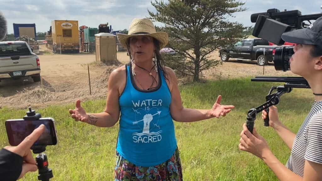 Winona LaDuke, founder and then-executive director of Honor the Earth, speaks about a protest march on June 7, 2021, to stop construction of Enbridge's Line 3 pipeline project in northern Minnesota. (Photo by Mary Annette Pember/ICT)