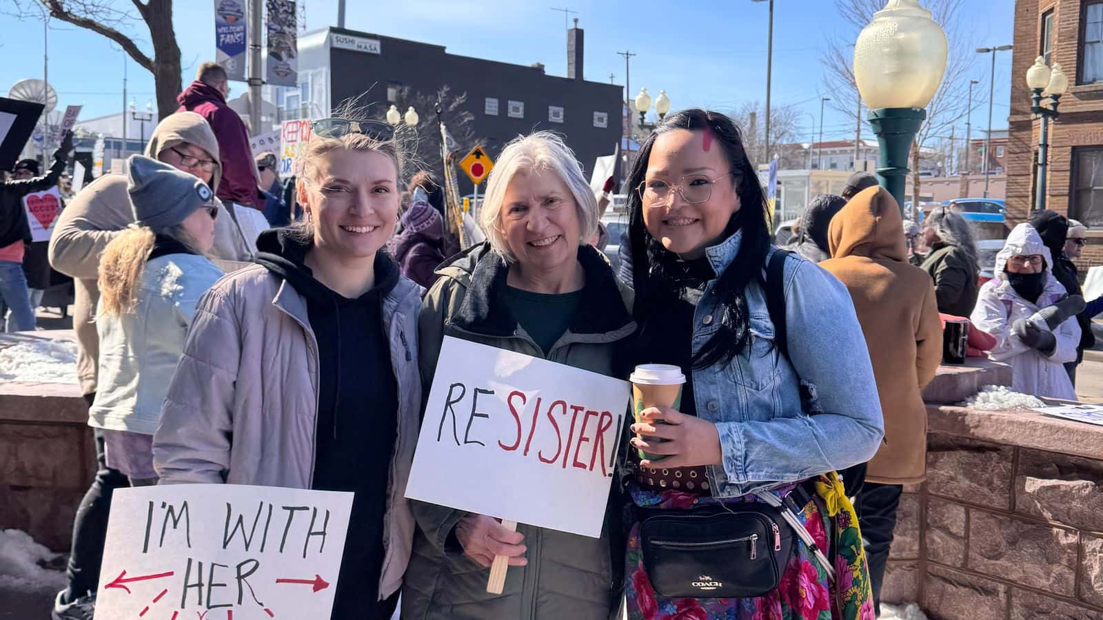 Allison Renville protests with friends at the International Women’s Day rally in Sioux Falls, South Dakota.