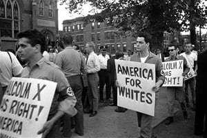 Members of the American Nazi Party march with signs across the street from Chicago's Greater Mount Hope Baptist Church, the site of a meeting between Dr. Martin Luther King Jr. and civil rights workers on Aug. 19, 1966. (AP Photo)