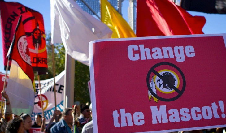 protest sign against washington redskins from native american indians