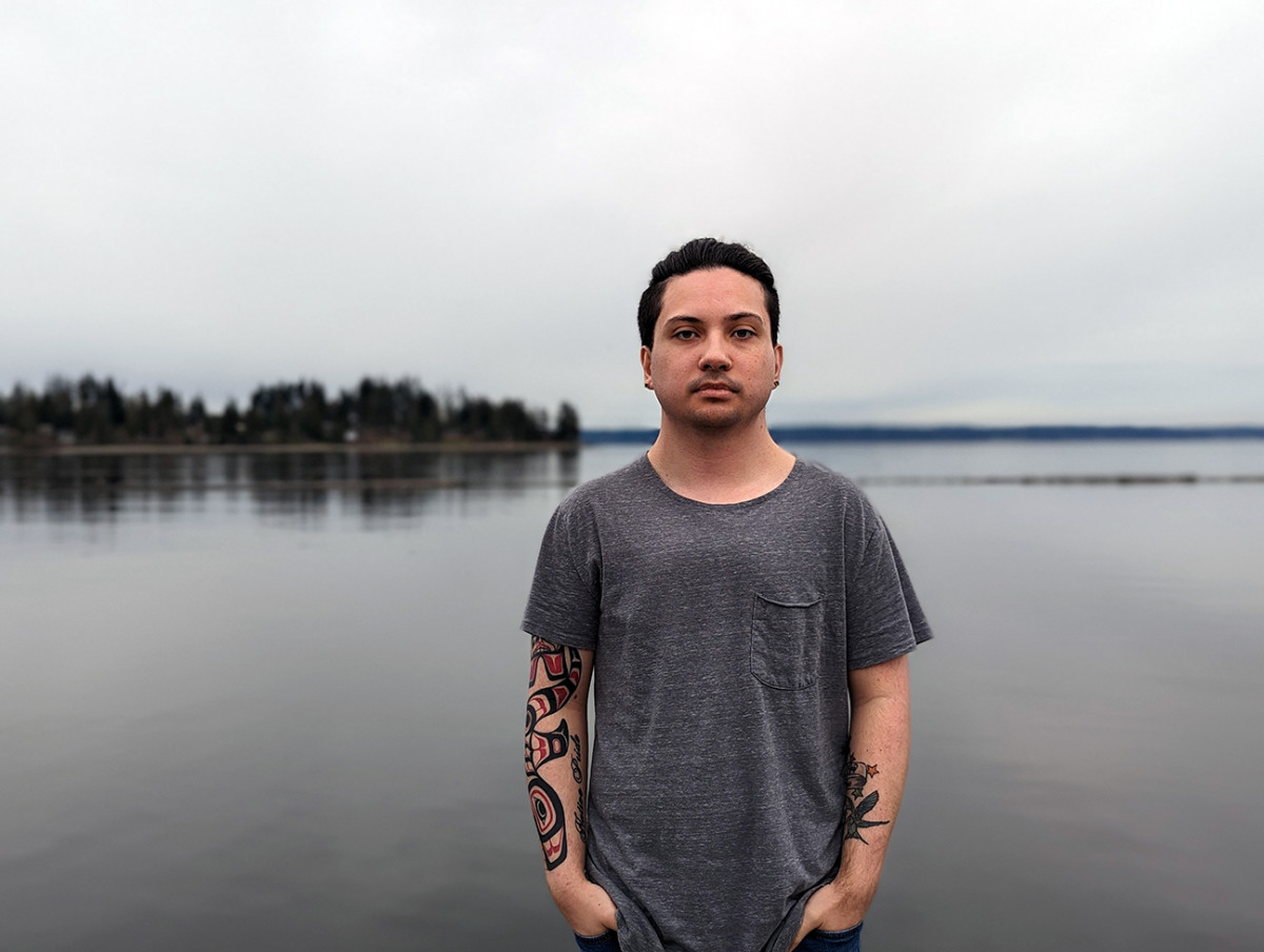 Andres “Dre” Thornock, 23 stands in front of the Tulalip Marina. Thornock spent 15 years in the Tulalip Tribes' foster care system. (Nancy Marie Spears, The Imprint)