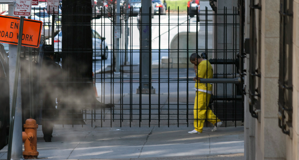 A defendant walks from a Baltimore courthouse