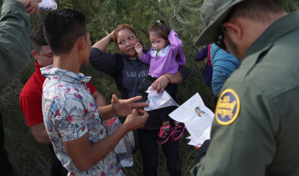 U.S. Border Patrol agents ask a group of Central American asylum seekers to remove hair bands and wedding rings before taking them into custody on June 12 near McAllen, Texas.
John Moore/Getty Images