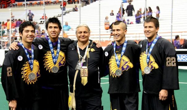 The four Thompson Brothers stand with Iroquois National host Tracy Shenandoah (center) at the Lacrosse championships in Syracuse New York in 2015. Photo Vincent Schilling