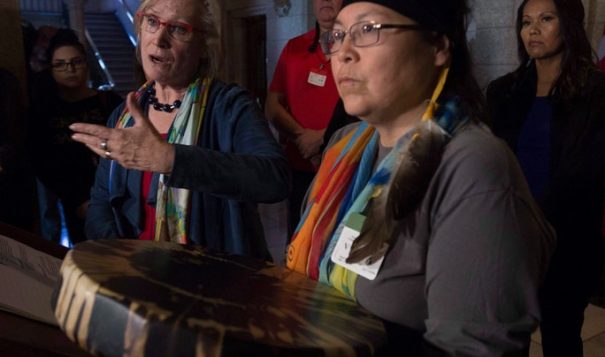 Chief Marcia Brown Martel (right) Sixties Scoop survivors and Crown-Indigenous Relations and Northern Affairs Minister Carolyn Bennett (left) - Adrian Wyld / The Canadian Press via AP