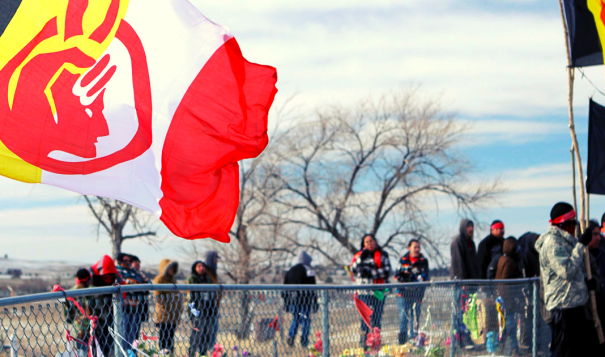 Participants in the 4 Direction Walk to Wounded Knee, South Dakota, in February 2014 native american flag