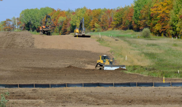 Construction workers grade over the location of the buried Enbridge Line 3/Line 93 pipeline in Clearwater County, Minnesota, on Oct. 5, 2021. (Photo by Mary Annette Pember/Indian Country Today)