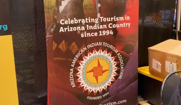 Sign at the American Indian Alaska Native Tourism Association annual conference held near Phoenix in October 2021. (Screenshot from video by Patty Talahongva, Indian Country Today)

