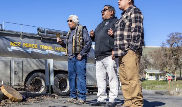 Nez Perce tribal elder Charles Axtell (left), NPTEC Vice-Chairman Shannon Wheeler and NPTEC Treasurer Casey Mitchell sing ceremonially on Wednesday before releasing thousands of juvenile spring chinook into Sweetwater Creek near Webb.