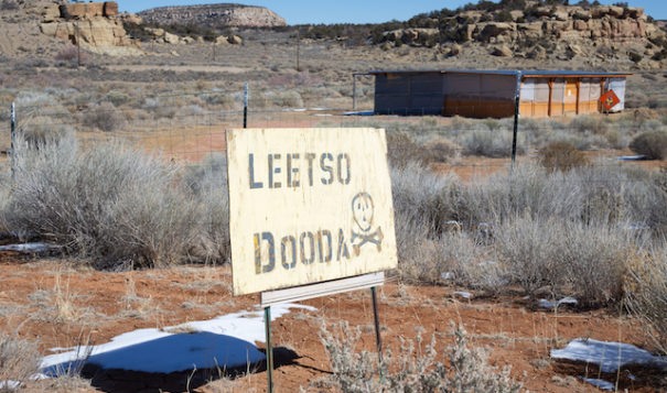 A sign in Diné reads “Leetso Dooda,” meaning “No Uranium,” stands south of the the Quivira (formerly Kerr-McGee) uranium mine in the Red Water Pond Road community and next to their meeting house where the community will hold the 43rd annual commemoration for the mine spill into the Rio Puerco.