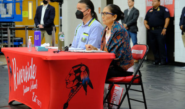 U.S. Interior Secretary Deb Haaland, Laguna Pueblo, sits with Assistant Secretary of Indian Affairs Bryan Newland to hear testimony from Indian boarding school survivors at the Road to Healing hearing at Riverside Indian School in Anadarko, Oklahoma on Saturday, July 9, 2022. (Photo by Mary Annette Pember/ICT)