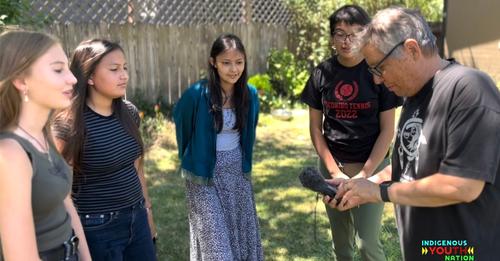 A new radio program, "Indigenous YOUth Nation," is aimed at Native youths in remote locations where radio plays an important role. Here, producer Gregg McVicar explains details of audio recording to four participants, from left, Bahiyyah, Dahi, Deezhchiil and Bahozhoni. (Photo courtesy of Jeneda Benally)