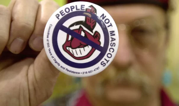 Powwow attendee Sonny Hensley holds an anti-mascot button to protest using Indians as mascots for sports teams at the 2003 New Years Eve Sobriety Powwow in Columbus, Ohio.
Mike Simons/Getty Images