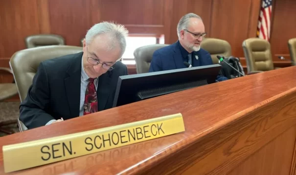 South Dakota state Sens. Lee Schoenbeck, left, a Watertown Republican, and Reynold Nesiba, a Sioux Falls Democrat, attend a committee hearing during the 2023 legislative session. (Joshua Haiar/SD Searchlight).