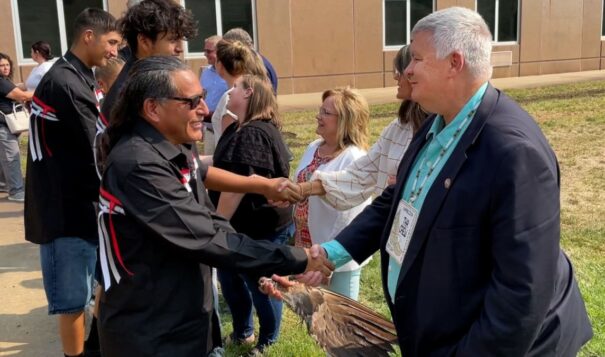 Mark Vargo, right, shakes hands with members of the Wambli Ska Society on Sept. 13, 2022, in Pierre. (Courtesy of SD Attorney General’s Office)