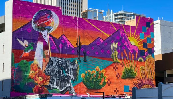 The Phoenix City Council on April 19, 2023, officially designated the second Monday in October as Indigenous Peoples' Day. This mural in downtown Phoenix was painted as part of Super Bowl LVII activities by Indigenous artist Lucinda Hinojos, the year's marquee artist for the Super Bowl. It is the largest NFL painted mural to date.  (Photo by Dalton Walker, ICT)